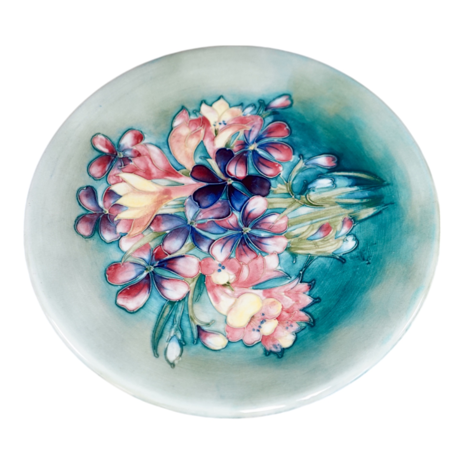 A Moorcroft spring flower pattern plate, signed to base, 26cm in diameter. Condition - good